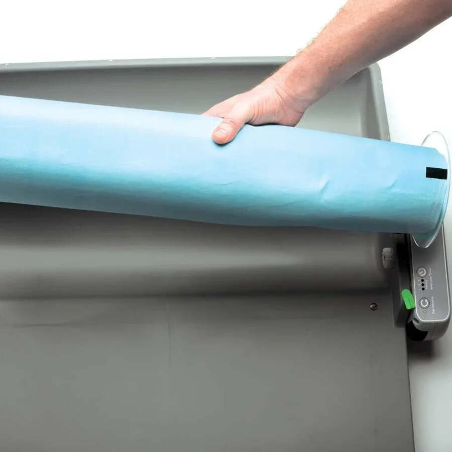 Rolled-up used pad being removed from the BrilliantPad Smart